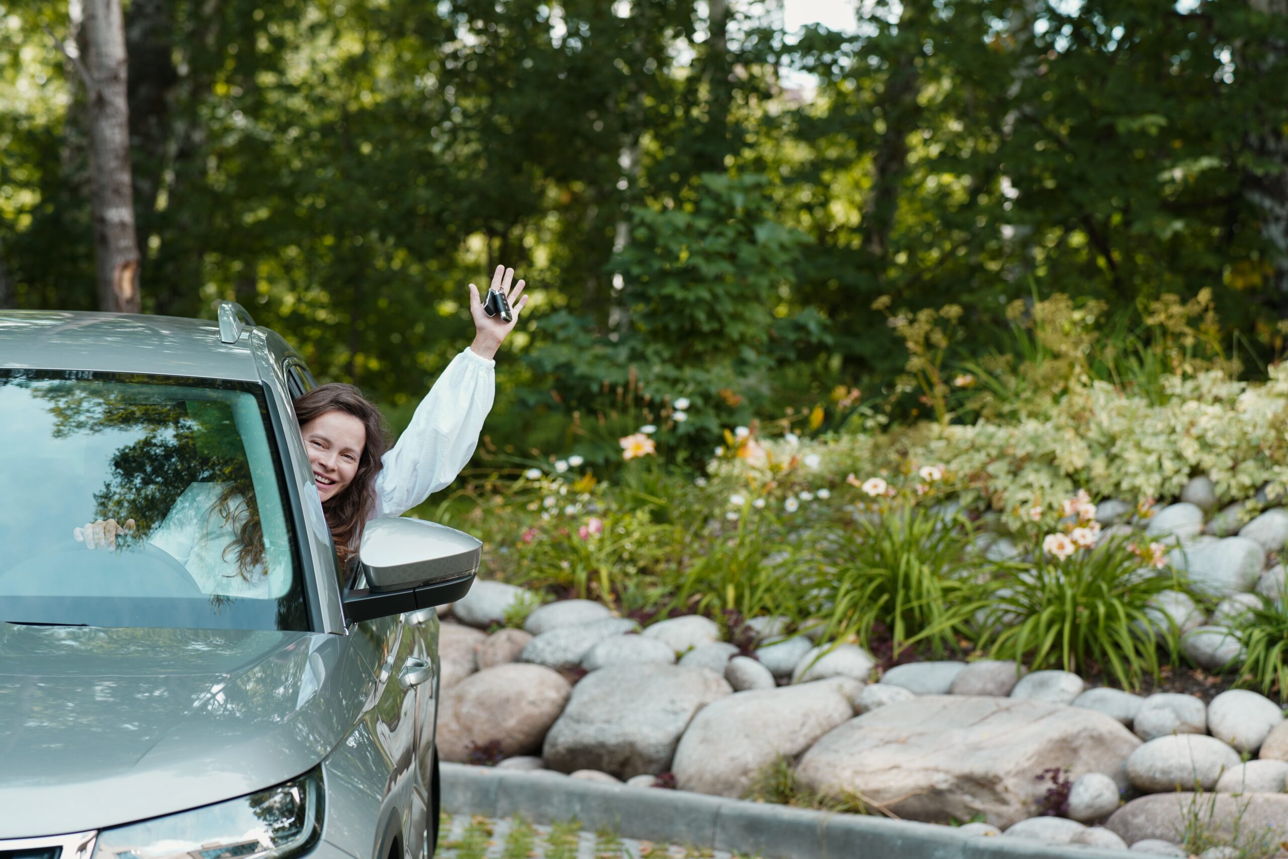 happy-smiling-adult-woman-driver-holds-the-keys-to-2023-11-27-04-55-00-utc